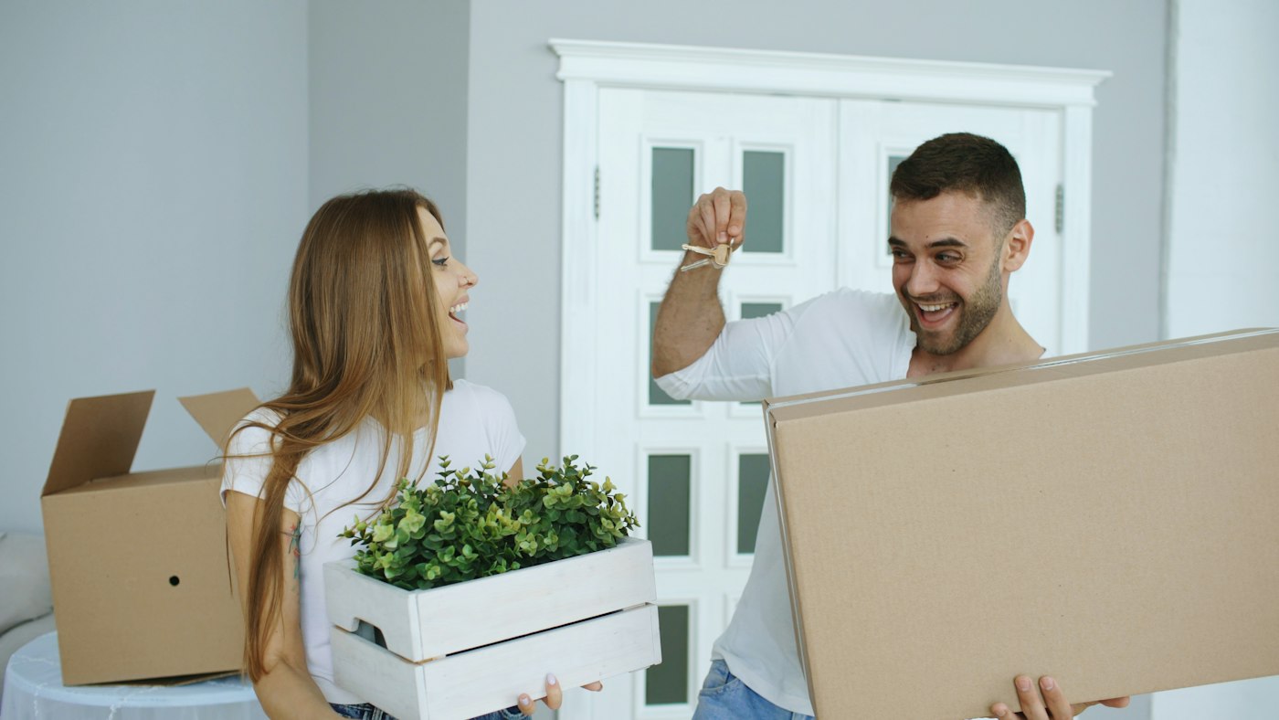 A couple at the door of their new home